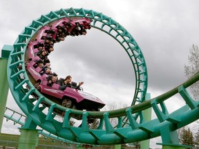 Park goer's are seen riding "The Vortex" corkscrew roller coaster at Calaway Park during its opening weekend. Sunday, May 19, 2019.