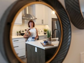 Laura Brodie, with her pooch Stella, loves the no-maintenance her new home at Arrive at D'Arcy Blvd.