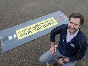 Ryan Lemont, a manager with AMA driver education, shows off a mat that shows the three second rule when following another car on the road, on Tuesday, Sept. 17, 2019.