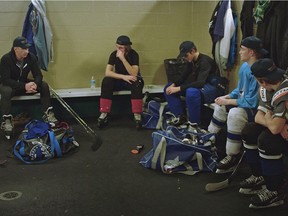 Brock McGillis with young hockey players. Screen capture from the NFB documentary Standing on the Line by director Paul Emile d'Entremont. It screens at the Calgary International Film Festival.