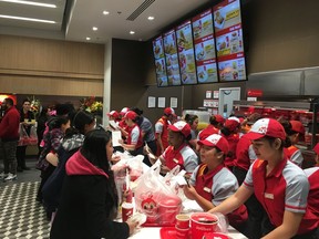 Hundreds lined up to get a taste of Calgary's new Jollibee restaurant at Pacific Place Mall on Friday, Sept. 20, 2019.