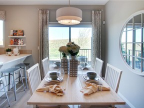 The dining area in the Brooks 20 show home by Cedarglen Homes in Seton.