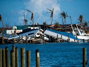 (FILES) In this file photo taken on September 11, 2019 destroyed boats are pushed up against the pier in the aftermath of Hurricane Dorian in Treasure Cay on Abaco island, Bahamas,. (Photo by Andrew CABALLERO-REYNOLDS / AFP)ANDREW CABALLERO-REYNOLDS/AFP/Getty Images