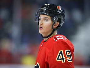 Calgary Flames Jakob Pelletier during warm-up before facing the Vancouver Canucks during pre-season NHL hockey in Calgary on Monday September 16, 2019. Al Charest / Postmedia