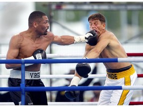 Donny Lalonde (right) reels from a punch by Virgil Hill during a cruiser weight fight Saturday July 5, 2003, in CanWest Global Park, Winnipeg. Hill won the fight in a unanimous decision after ten rounds. A stronger, faster Virgil Hill gave a boxing lesson Saturday night and threw the first pail of cold water on Donny Lalonde's comeback dream of winning another world championship.n/a ORG XMIT: WPGS101