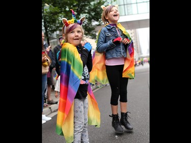 Young spectators jump in anticipation as Calgarians from all walks of life celebrated pride week with the Calgary Pride parade through downtown Calgary on Sunday September 1, 2019.
