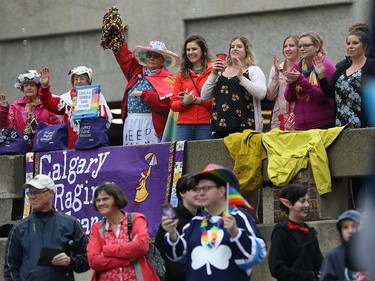 Spectators watch as the Calgary Pride parade through winds through downtown Calgary on Sunday September 1, 2019.