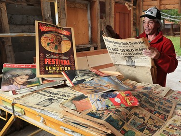 Alex Clarke looks through a treasure trove of old newspapers and magazines from the 1930’s and 1940’s he found while demolishing a garage in Bridgeland on Tuesday, September 17, 2019. The vintage items had been used as insulation in the walls but were surprisingly well preserved. Besides local papers The Albertan and The Calgary Herald, there were also Ukrainian papers and papers and magazines from Montreal, Toronto and Chicago. Clarke, who was formerly homeless, was demolishing the garage carefully by hand with the goal of recycling as much of the material as possible. The demolition was part of a larger project renovating the property for the RCCG Christ Embassy church. Clark hopes the project, which also employed homeless workers from the Calgary Drop-In Centre, will be the first of many to show how the homeless community can work together on eco-friendly community construction projects.
