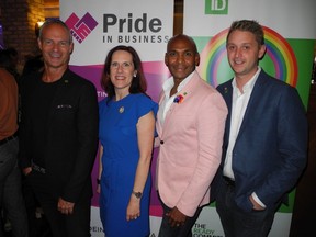 The Pride in Business fashion show held Aug. 28 in Thomson's Restaurant at the Hyatt Regency was a great success thanks to partner and presenting sponsor TD Canada Trust. Pictured, from left are Grant Minish, TD Bank Group regional manager and LGBTQ2+ business development; Kari Scarlett, TD Canada Trust manager of community banking, Al Ramsay, TD Bank Group LGGTQ2+ national director; and TD Bank Group's Tyler Brown.