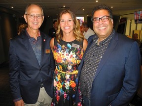 Commemorating Murray Sigler's retirement from Sport Calgary are, from left: Sigler; Sport Calgary's incoming president and CEO Catriona Le May Doan; and Mayor Naheed Nenshi.