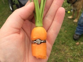 Danielle "DeeJay" Squires holds her engagement ring on a carrot.