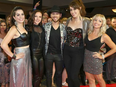 Brett Kissel (C) and Calgary country band NIce Horse pose together on the red carpet at the Canadian Country Music Awards at the Saddledome in Calgary Sunday, September 8, 2019. Jim Wells/Postmedia