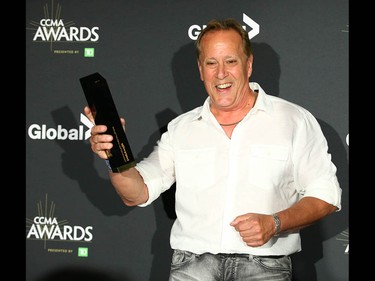 Charlie Major poses with his award after being inducted into the The Country Music Hall of Fame at the Canadian Country Music Awards at the Saddledome in Calgary Sunday, September 8, 2019. Jim Wells/Postmedia