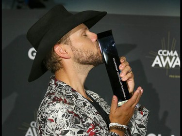 Brett Kissel poses with his award after winning for Fans’ Choice Award at the Canadian Country Music Awards at the Saddledome in Calgary Sunday, September 8, 2019. Jim Wells/Postmedia