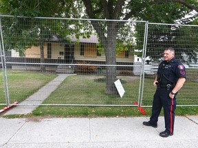 Calgary Police join Alberta Sherrifs close down a house in 2000 blk of  Cottonwood Cr SE in Calgary on  Tuesday, September 17, 2019. It is the second time the same house has been shut down. The Safer Communities and Neighborhoods Unit (SCAN) obtained a warrant to close the house for 90 days and impose strict conditions on the property's use for the next five years. Jim Wells/Postmedia