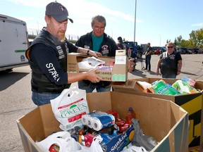Veterans and volunteers drop off and collect donations at the Veterans Association Food Bank "Food Drive and Fund Raiser” at the Canadian Tire in northwest Calgary on Saturday, September 21, 2019.
