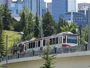 A CTrain rolls northwest out of downtown Calgary.