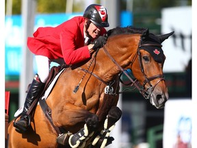 Ian Millar rides Dixson in the Nations' Cup during the Masters at Spruce Meadows last September. File photo by Jim Wells/Postmedia.