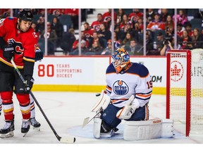 Sep 28, 2019; Calgary, Alberta, CAN; Edmonton Oilers goaltender Mikko Koskinen (19) makes a save as Calgary Flames left wing Milan Lucic (17) tries to score during the first period at Scotiabank Saddledome. Mandatory Credit: Sergei Belski-USA TODAY Sports ORG XMIT: USATSI-406700