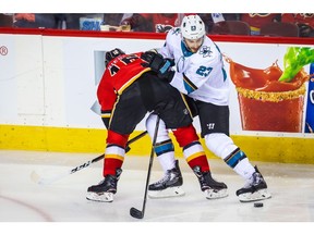 Sep 18, 2019; Calgary, Alberta, CAN; San Jose Sharks right wing Barclay Goodrow (23) and Calgary Flames right wing Tobias Rieder (16) battle for the puck during the third period at Scotiabank Saddledome. Calgary Flames won 6-4. Mandatory Credit: Sergei Belski-USA TODAY Sports ORG XMIT: USATSI-406631