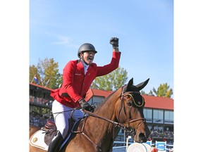 Belgium's Francois Jr Mathy celebrates on his mount Uno De La Roque after clinching the gold medal in the second round of the BMO Nations' Cup in the International Ring during The Masters show jumping event at Spruce Meadows in Calgary on Saturday, September 7, 2019. Jim Wells/Postmedia