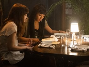Director Lorene Scafaria and Constance Wu behind the scenes on the set of Hustlers.