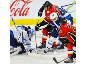 Winnipeg Jets goalie Eric Comrie with a save on Milan Lucic of the Calgary Flames during pre-season NHL hockey in Calgary on Tuesday September 24, 2019. Al Charest / Postmedia