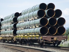 Pipes destined for the Trans Mountain pipeline are transported by rail through Kamloops June 25 2019. ( Gerry Kahrmann / PNG staff photo)