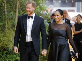 Britain's Prince Harry, Duke of Sussex (L) and Britain's Meghan, Duchess of Sussex arrive for the European premiere of the film The Lion King in London on July 14, 2019.