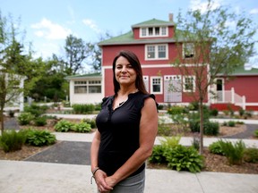 Owner Sal Howell is photographed outside the Deane House restaurant.