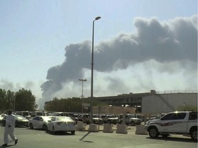 In this Saturday, Sept. 14, 2019 file photo, made from a video broadcast on the Saudi-owned Al-Arabiya satellite news channel, smoke from a fire at the Abqaiq oil processing facility fills the skyline, in Buqyaq, Saudi Arabia.