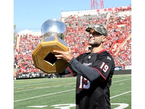 Calgary Flames captain Mark Giordano shows the Norris Trophy to fans during the Labour Day classic at McMahon stadium in Calgary on Monday, September 2, 2019. Darren Makowichuk/Postmedia