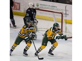 University of Alberta Golden Bears Luke Philp 12) and Steven Owre (13) celebrate a goal scored on University of Saskatchewan Huskies goalie Taran Kozun during Canada West Men's hockey final action on Friday, March 2, 2018  in Edmonton. Greg  Southam / Postmedia Photos for copy in Saturday, March 3 edition