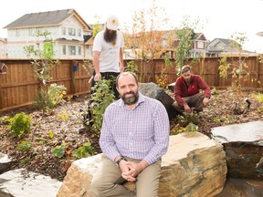 Tamer El-Masri in his edible garden with Jeremy Zoller from Sunshine Earth Works and  Brad Robertshaw from Adept.