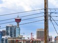 Pictured is a power line with the downtown skyline in the background in Calgary on Thursday, October 17, 2019. Azin Ghaffari/Postmedia Calgary