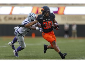 Running back Chuba Hubbard of the Oklahoma State Cowboys comes up just short of the end zone against linebacker Da'Quan Patton of the Kansas State Cowboys on Sept. 28 at Boone Pickens Stadium in Stillwater, Okla.