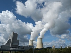 Steam rises from cooling towers at the Schwarze Pumpe coal-fired power plant on September 19, 2019 in Spremberg, Germany.  While Germany has made some progress in expanding its renewable energy production over the last few decades, the government has come under criticism more recently for failing to do more to bring down greenhouse gas emissions.