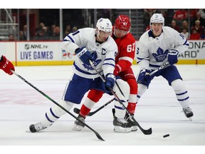 Red Wings forward Taro Hirose is in hot pursuit of Maple Leafs captain John Tavares at Little Caesars Arena on Oct. 12 in Detroit.