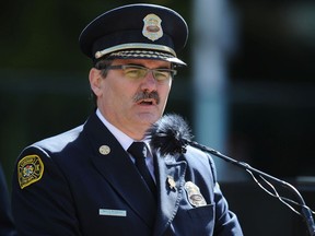 Former Calgary fire chief Bruce Burrell speaks to firefighters and families of lost firefighters at the 2112 Fallen Firefighters Memorial at the Police Officers and Firefighters Tribute Plaza on September 11, 2012 in downtown Calgary, Alberta.