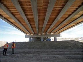 The ring road continues to grow in Calgary. In this archived photo, engineers stand underneath the new ring road bridges crossing the Elbow River west of the Weaselhead area. Gavin Young/Postmedia