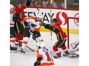 The Calgary Flames' Johnny Gaudreau scores in overtime to defeat the Philadelphia Flyers 6-3 in NHL action at the Scotiabank Saddledome in Calgary on Wednesday December 12, 2018. Gavin Young/Postmedia