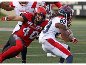 The Calgary Stampeders' Nate Holley lines up to tackle the Montreal Alouettes' Shakeir Ryan during CFL action at McMahon Stadium in Calgary on Saturday August 17, 2019.  Gavin Young/Postmedia