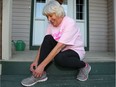 Breast cancer survivor Cyndie McOuat poses for a photo outside her Chestermere home prior to the CIBC Run for the Cure.