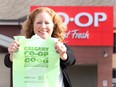 Sage Pullen McIntosh, communications manager with Calgary Co-op, poses with biodegradable bags that will reduce the amount of plastic waste beginning in 2020.