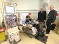 Dr Stefan Mustata, right, and fundraiser Jim Gray greet patient Flordeliza Mutuc in the Hemodialysis Unit at the Sheldon Chumir Centre in downtown Calgary on Tuesday, October 29, 2019. Patients and caregivers are benefiting from new remote controlled chairs that allow them to use stationary cycles for exercise while receiving treatment.