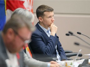 Councillor Farkas listens in council chambers.
