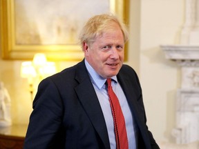 Britain's Prime Minister Boris Johnson prepares to greet European Parliament president David Sassoli prior to a private meeting at 10 Downing Street for a meeting in London on October 8, 2019. - Brexit talks between Britain and the European Union appeared to be on the verge of collapse on Tuesday, with Brussels accusing London of intransigence and threatening the bloc's future. (Photo by Aaron Chown / AFP)
