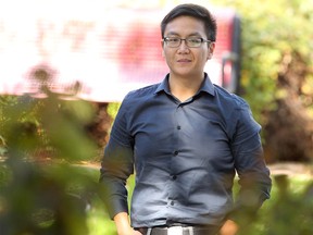 Andy Wu, a software developer with Pason, is photographed outside his Calgary office.