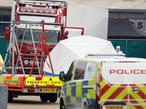 Police is seen at the scene where bodies were discovered in a lorry container, in Grays, Essex, Britain, October 23, 2019.