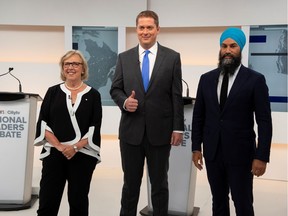 Green Party leader Elizabeth May, Conservative leader Andrew Scheer and New Democratic Party (NDP) leader Jagmeet Singh pose at the start of the Maclean's/Citytv National Leaders Debate on the second day of the election campaign in Toronto, Ontario, Canada September 12, 2019.